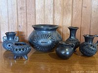 Group of five black clay barro negro vessels