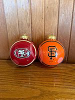 Front view of both ornaments showing team logos