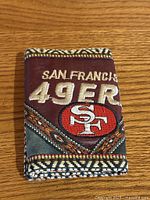 Front of wallet showing embroidered team name and logo