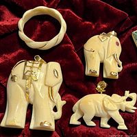 Front view of pendants and ring showing gold accents and ruby eye