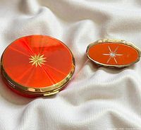 compact and lipstick holder closed on fabric