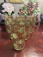 Six Culver Prado highball glasses gathered on wooden surface