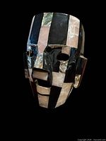 Front angled view of inlaid warrior mask