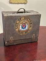 Front view showing police crest, handle, latches