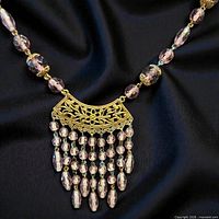 Close-up of necklace centerpiece and bead details