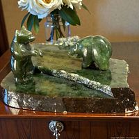 full view of jade sculpture showing standing and walking bear figures on jade base
