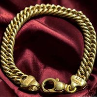 Bracelet coiled showing clasp stamped 925 and double curb links