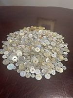 pile of assorted mother of pearl buttons