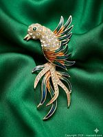 Front view showing rhinestones, enamel colours and overall design