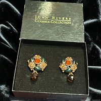 Earrings inside original Joan Rivers Classics Collection box showing full design