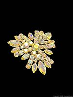 Front view of signed Sherman brooch showing overall design and stone arrangement