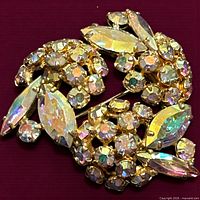 Front view showing stone arrangement and gold-tone setting