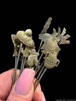 Hand holding selection to illustrate scale and detail