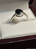 Ring on padded insert showing band and stone