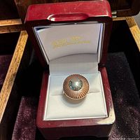 ring in presentation box showing two-tone face