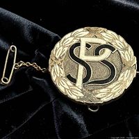 Front view showing laurel wreath border and SPS initials