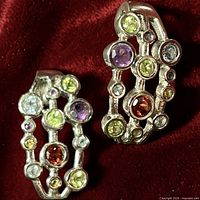 Front view of both sterling silver gemstone hoops showing multicolour stones