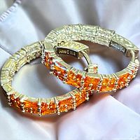 close-up of both hoops showing stones and 925 mark