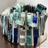 Exterior view of bracelet showing pewter bars and multicoloured glass tiles