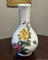 Full view of vase left side showing yellow peony and calligraphy