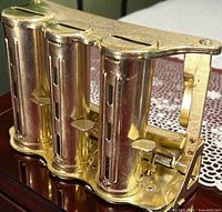 Front angled view showing all four coin tubes and mechanism