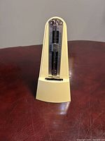 Front view showing full metronome and tempo scale