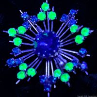 UV light view showing fluorescent yellow-green uranium glass stones