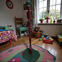 Full view of coat rack in a child’s bedroom setting