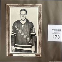 Front of Bee Hive photo showing Bob Nevin portrait with printed name plate
