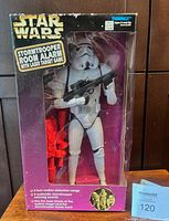 Front view of sealed box showing Stormtrooper figure and laser target accessory