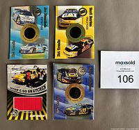 Fronts of four NASCAR relic cards showing tire and banner patches