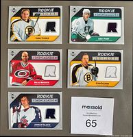 Front view of all five Rookie Threads cards showing player images and jersey swatches