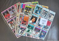 Assortment of 1982-83 O-Pee-Chee NHL cards fanned with binder pages visible