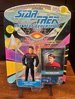 Front view of sealed Cadet Wesley Crusher figure on card with bonus card visible
