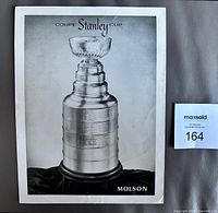Front view of black-and-white Stanley Cup promotional photo with Molson logo