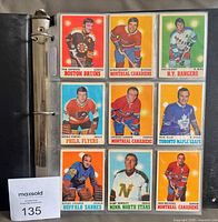 Binder page showing nine cards including Phil Esposito, Bernie Parent, Jean Béliveau, etc.