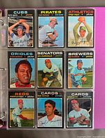 Binder page with 9 cards including Cubs Larry Gura, Pirates Rich Hebner, Athletics Diego Segui, Orioles Grant Jackson, Senators Jim Shellenback, Brewers Diego Segui, Reds Wayne Granger, Cards Fred Norman, Cards Julian Javier