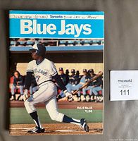 Front cover of 1980 Blue Jays program showing batter and title banner