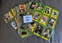 Fan of binder pages displaying front of Raiders of the Lost Ark cards