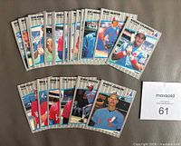 Front view of all 26 cards spread out, showing player fronts including Randy Johnson RC