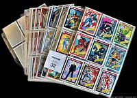 Binder pages fanned showing multiple Marvel cards