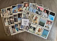 Spread of multiple binder pages showing numerous Space Shots cards