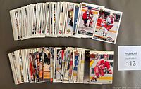 Two stacks of Upper Deck hockey cards with visible Paul Kariya rookie and other stars