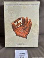 Front of slipcase showing glove image and Sotheby's branding