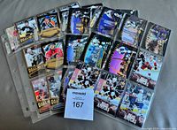 Binder pages showing various 2005-06 Upper Deck insert cards including Hard Knocks, Goal Celebrations and others