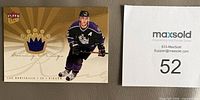 Front of 2006 Fleer Ultra Scoring Kings Luc Robitaille jersey patch card showing player image and crown window with purple fabric