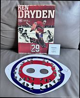 Front of program and front of cardboard mask displayed together