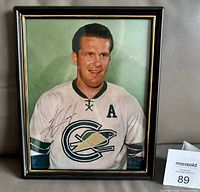 Front view of framed signed photo