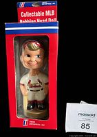 Front view of boxed bobblehead showing figure and packaging