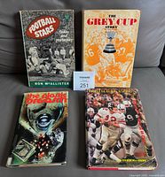 Front covers of all four vintage CFL books displayed